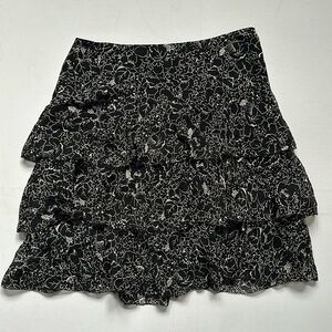 Silk tiered DKNY skirt with floral pattern and side zip. US 4